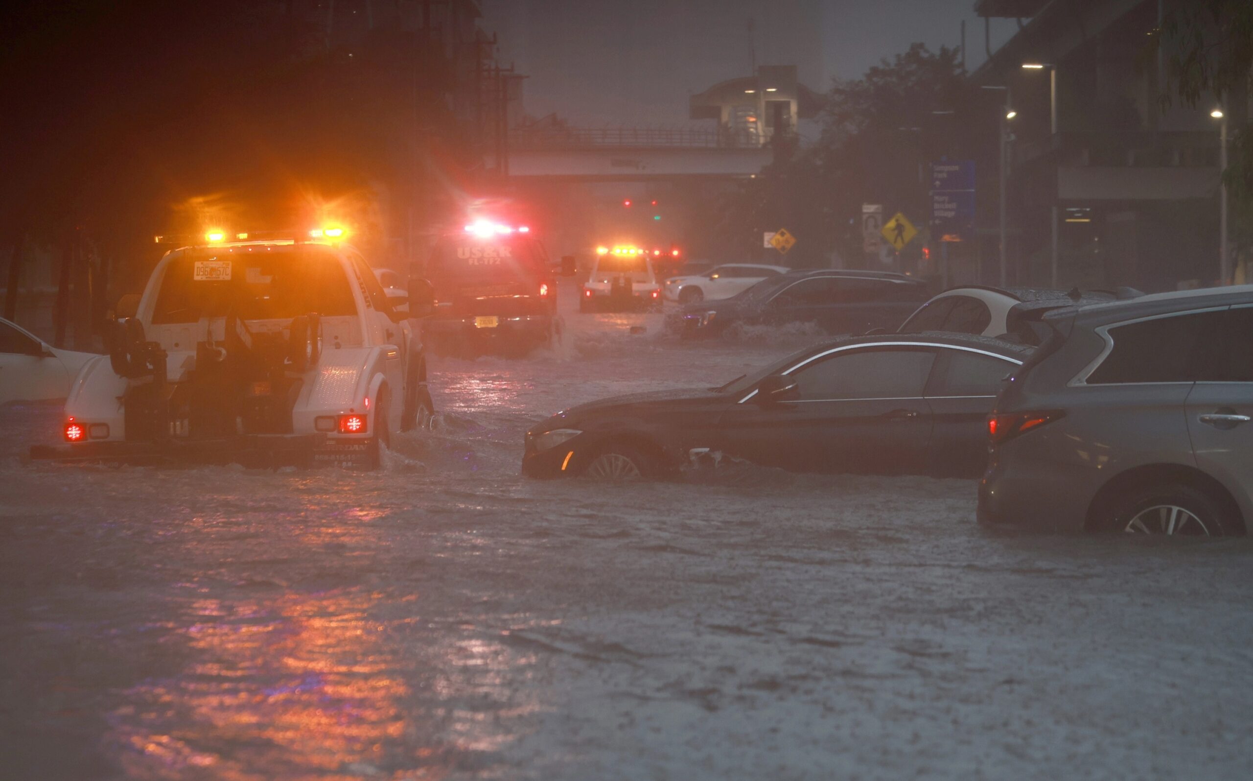 Shock images show Miami flooding and cars floating in up to 12 inches of water as city is
